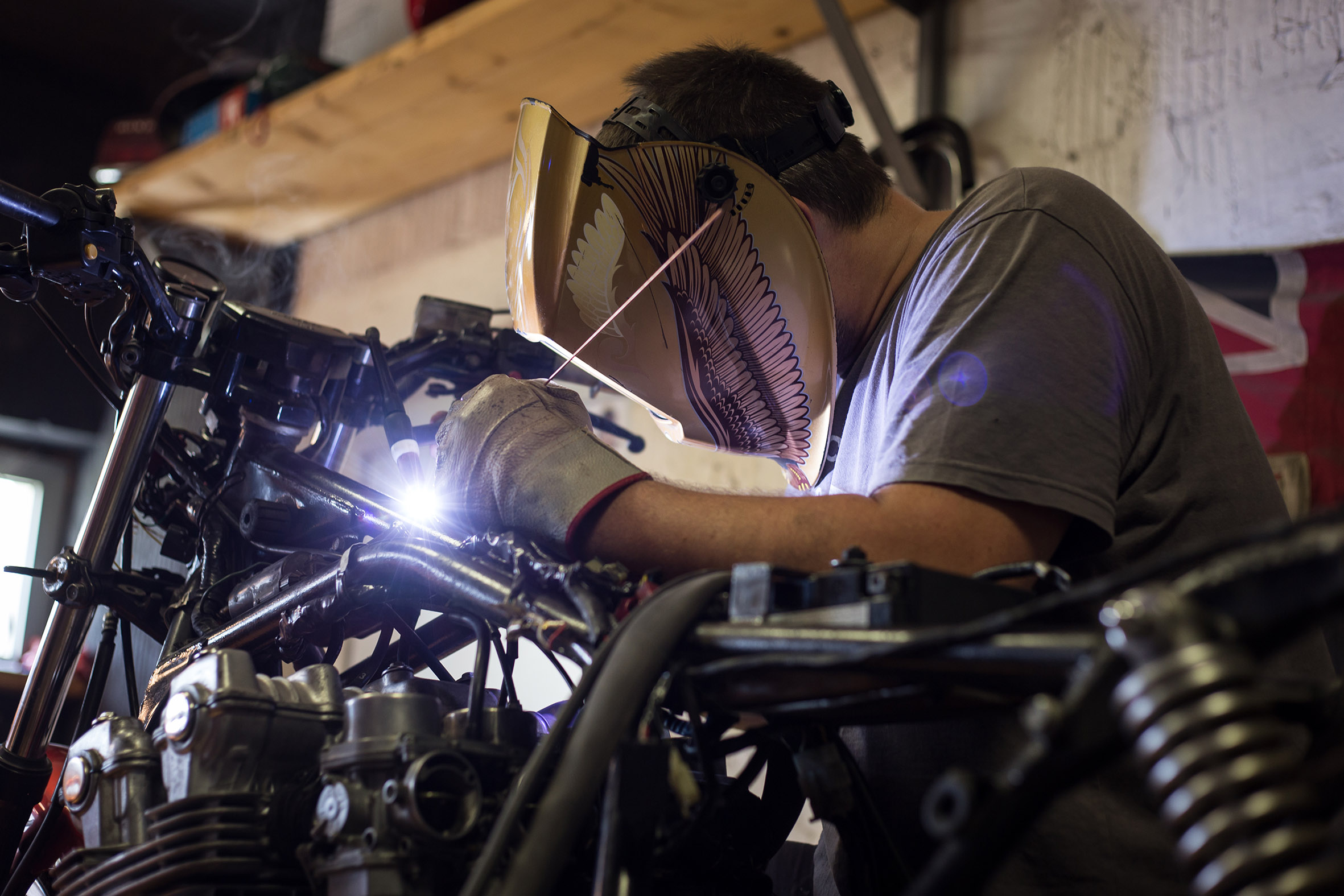 Man made transformation on custom bike. Indoors of custom motorc